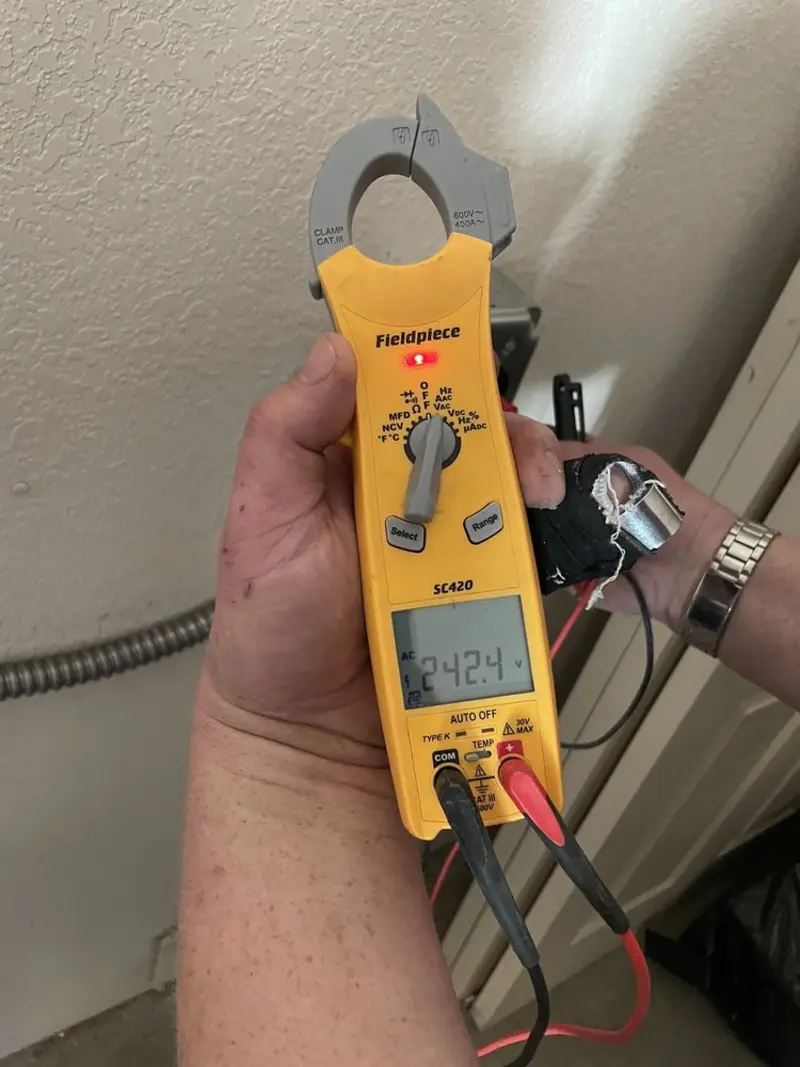 Voltage testing with clamp meter during Recessed Lighting Installation in Greenwood